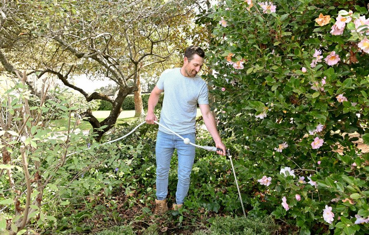 Man using root waterer