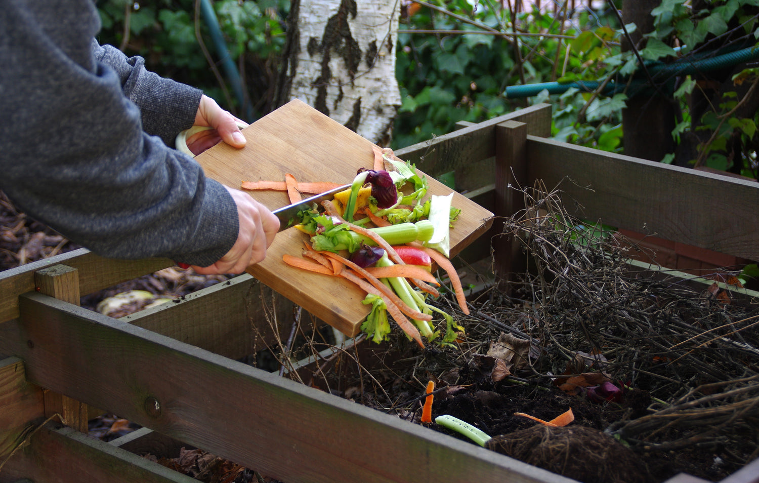 scrapping-food-scraps-onto-the-garden