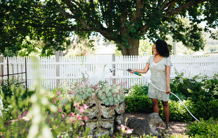 woman-watering-garden