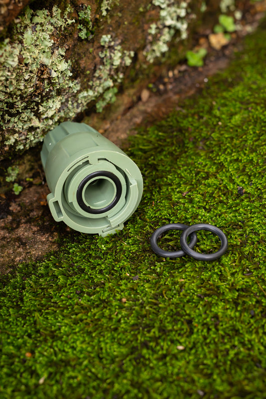 18mm fitting with 2 spare black o-rings on some moss