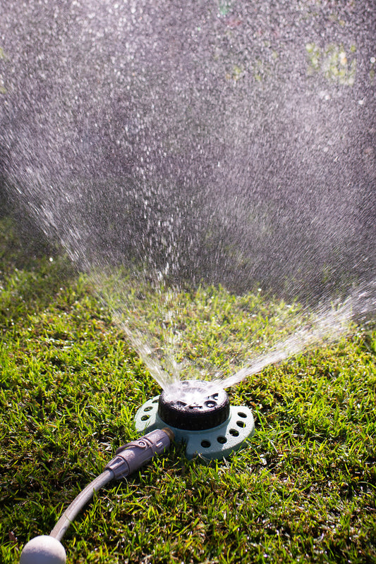 9-Pattern Sprinkler being used to water a small lawn