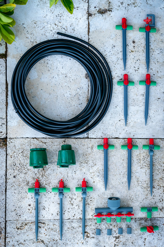 Close-up flatlay shot of Mini Sprinkler Kit components laid out on a paver