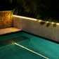 Solar LED Strip Lights mounted over and reflecting into a pool