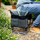 Close up of Garden kneeler and seat with green garden trowel  in tool pouch. 