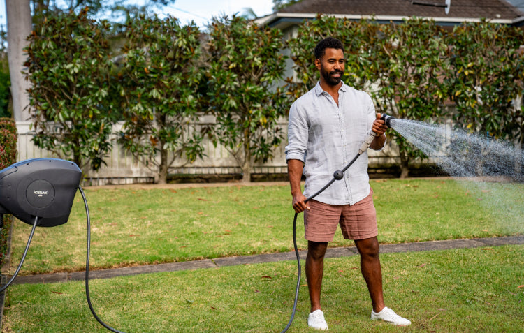 man-watering-garden