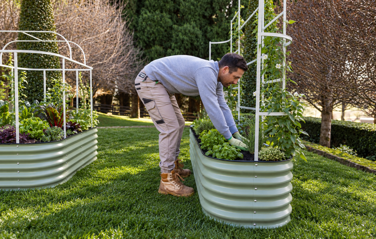 Man filling garden bed