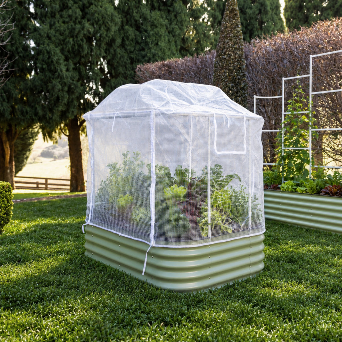 6 in 1 greenhouse PE cover attached to the garden bed sitting on the grass