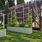 9 in 1 metal wall trellis attached to 9 in 1 Garden Bed on grass in front of trees