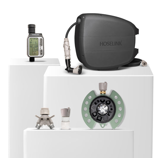 Charcoal evolve hose reel, green 9-pattern spirnkler, automatic tap timer, 2-way tap aapter and click-on adapter set bundle on a white background