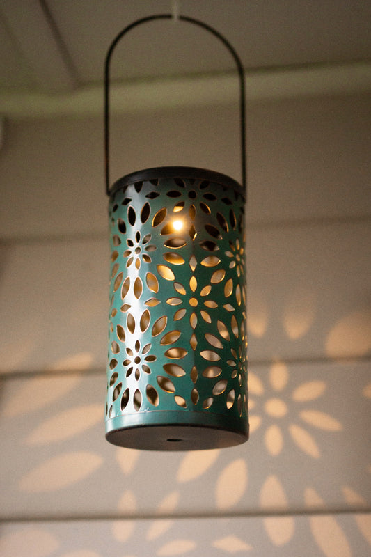 Decorative metal solar lantern light hanging from ceiling