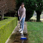 Firm bristle cleaning brush used on path