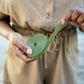 Reusable Hook and Loop Plant being held and unrolled