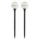 Two solar garden globe lights on a white background