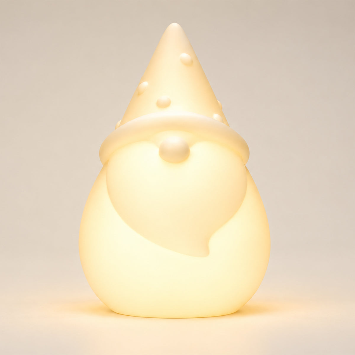 Solar Santa light on a white background, illuminated warm white in colour.