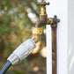 Brass Angled Tap Protector attached to a tap at one end then attached to a hose at the other