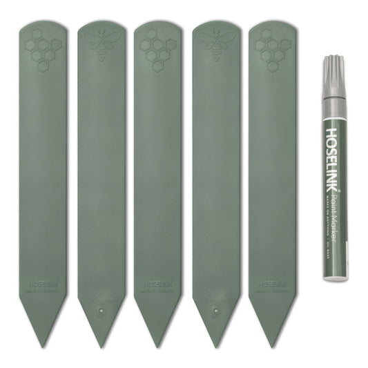 Set of five recycled plastic sage green plant labels and marker pen arranged neatly on a white background