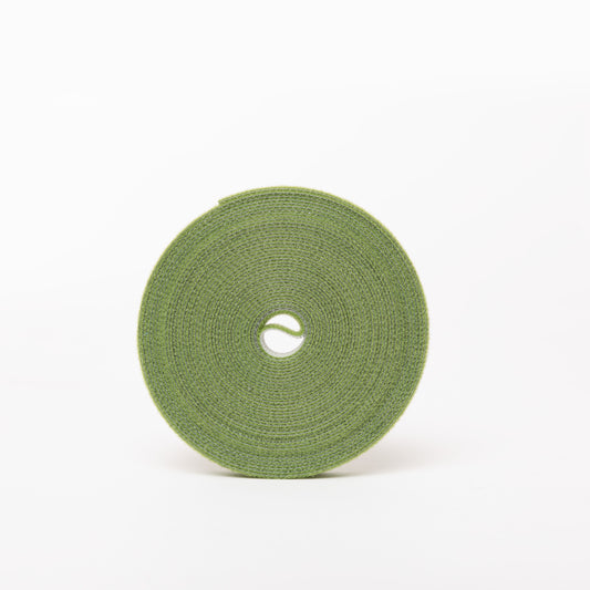 Green reusable plant tie on white background