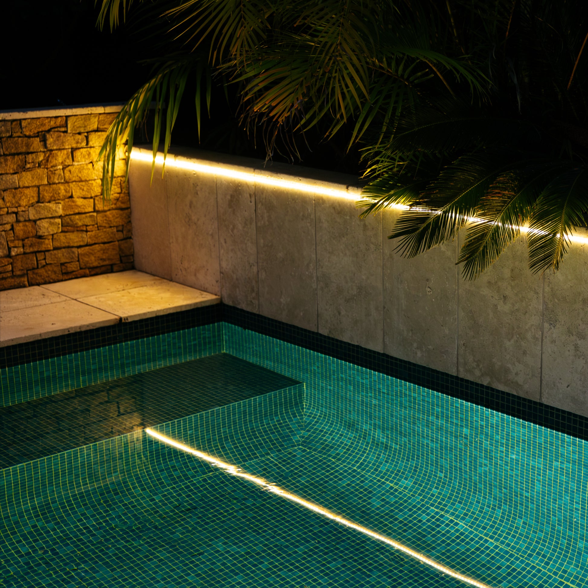 Solar LED Strip Lights mounted over and reflecting into a pool
