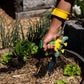 PETA Easi-Grip Arm Support Cuff attached to the PETA Easi-Grip Add-On Handle digging in a pot plant
