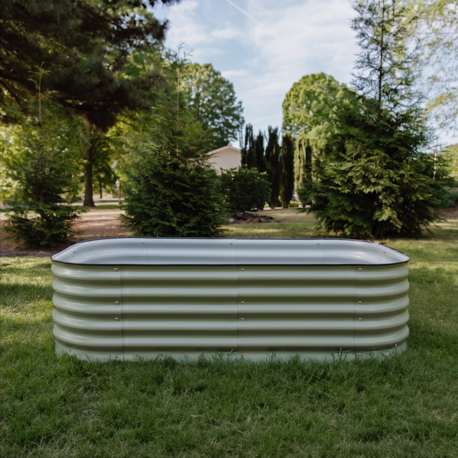 6 in 1 Garden Bed, front on image. Sitting on the grass, empty.