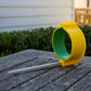 PETA Easi-Grip Arm Support Cuff sitting on a wooden deck by itself