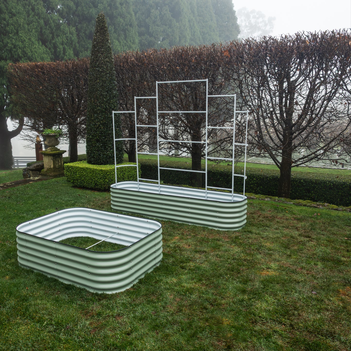 Metal Wall Trellis and 9 in 1  garden bed behind a 6 in 1 garden bed on grass