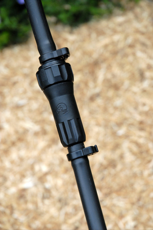 13mm n-line filter fitted to irrigation poly pipe with ratchet clamps on each end with straw mulch in the background