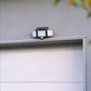 Solar Motion Floodlight above white garage door 