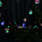 String of colorful LED lights on a dark background