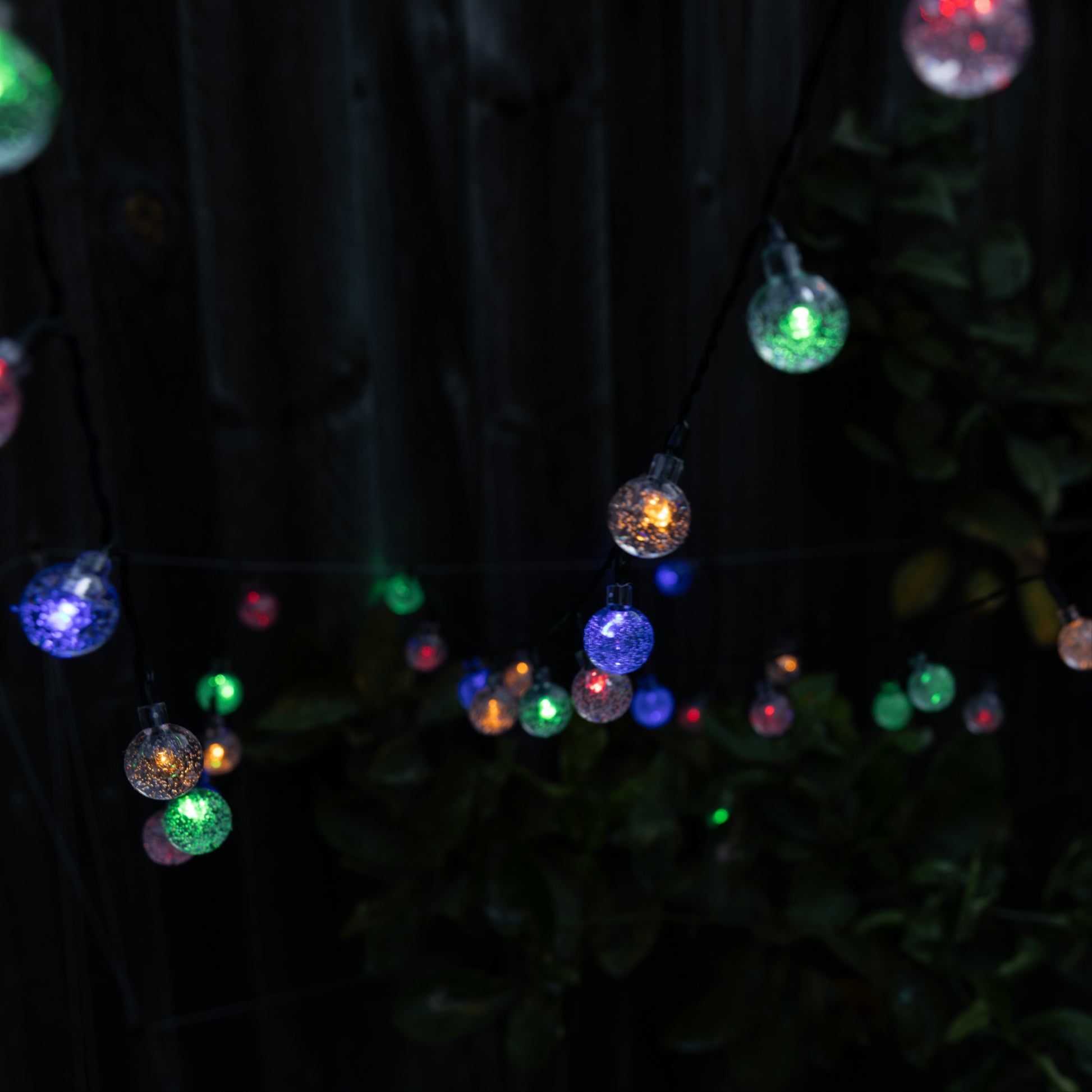 String of colorful LED lights on a dark background