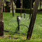two under tree sprinkler spikes each watering the base of a tree